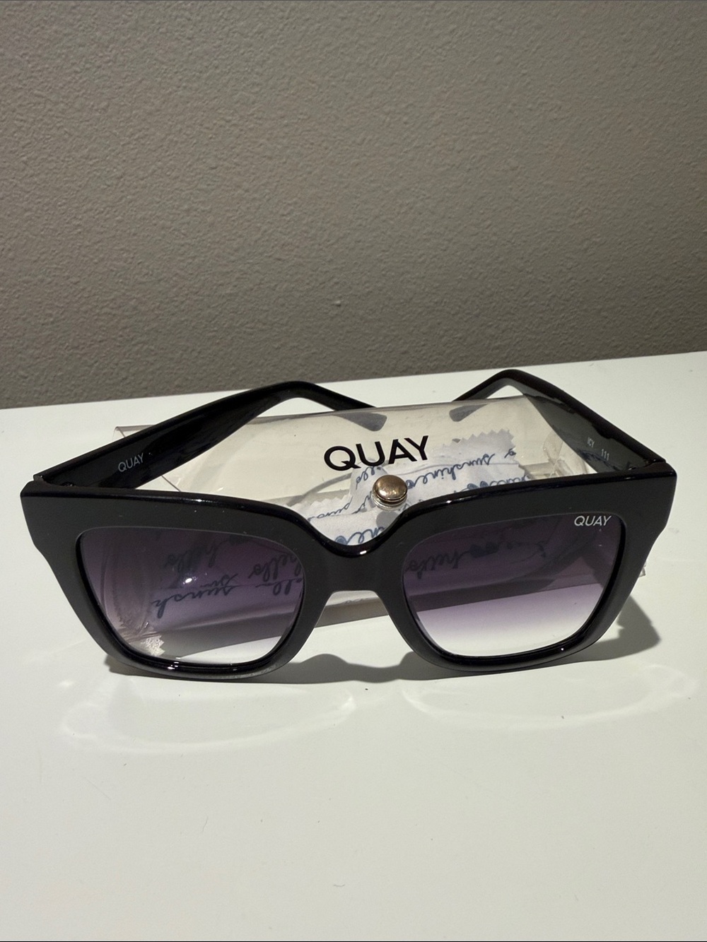 Quay “Icy” Black Frame Sunglasses with Gradient Purple Lenses